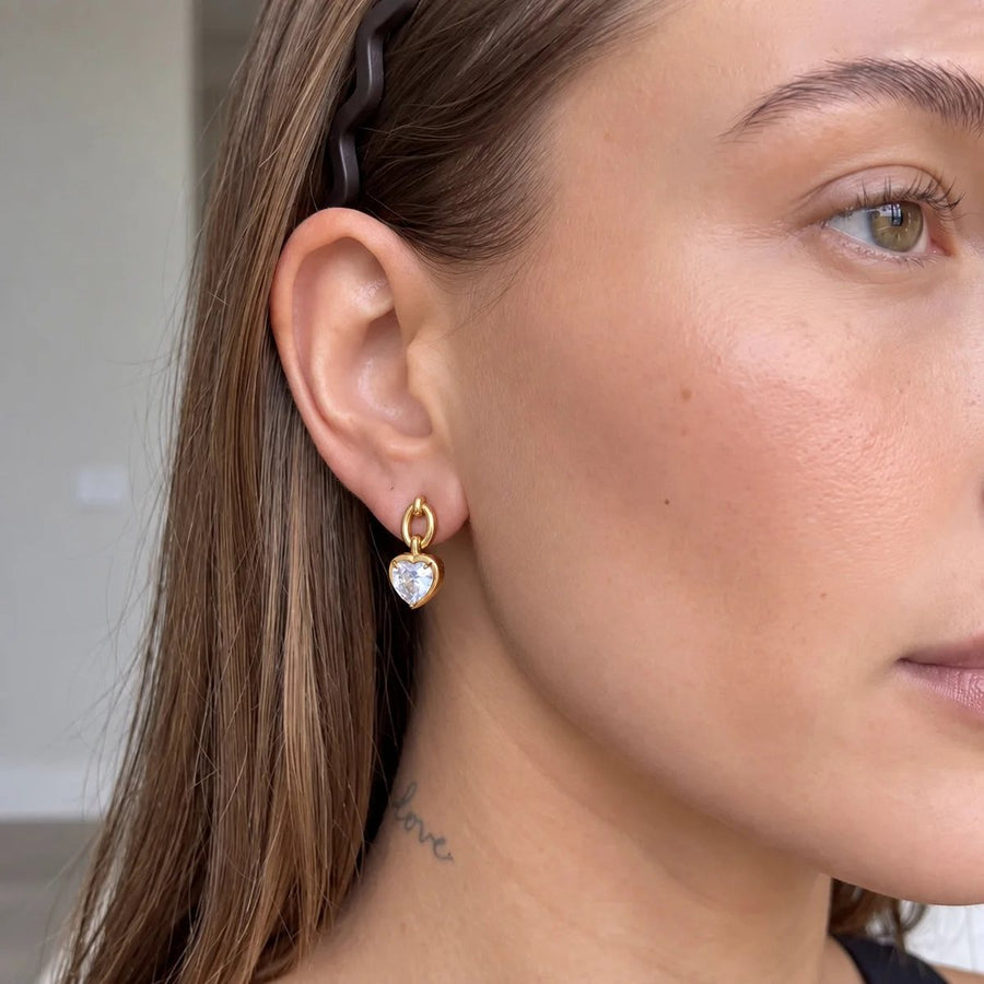Amour Heart Link Gold Drop Earrings on the ear, worn