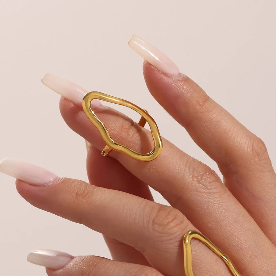 Contour Line Gold Stacking Ring on the hand, worn