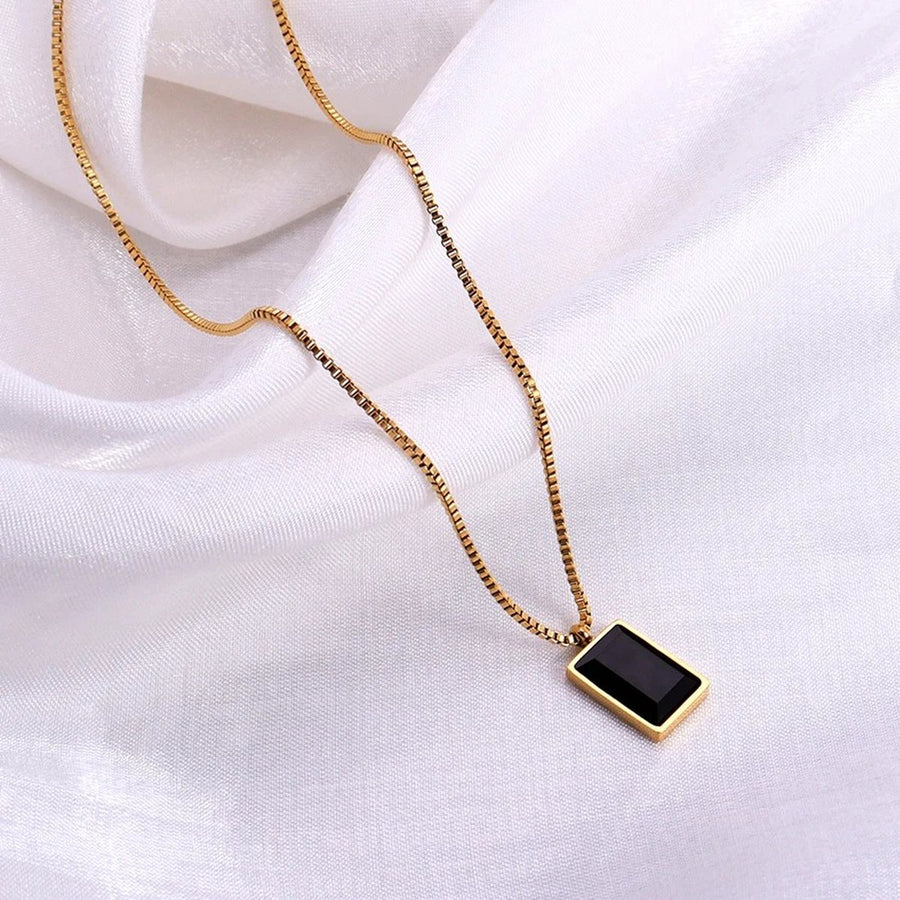 Ébène Square Gold Pendant Necklace, flat lay