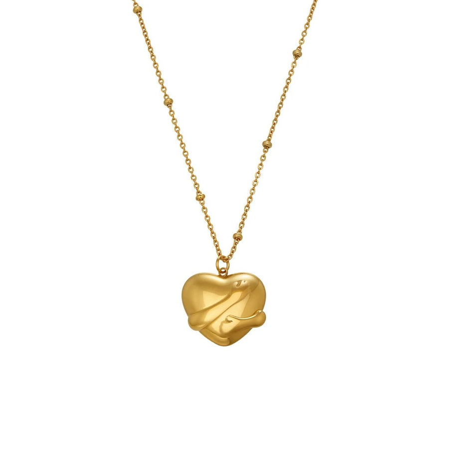 Embrace Gold Heart Necklace, sculpted gold heart held in an embrace on a beaded chain