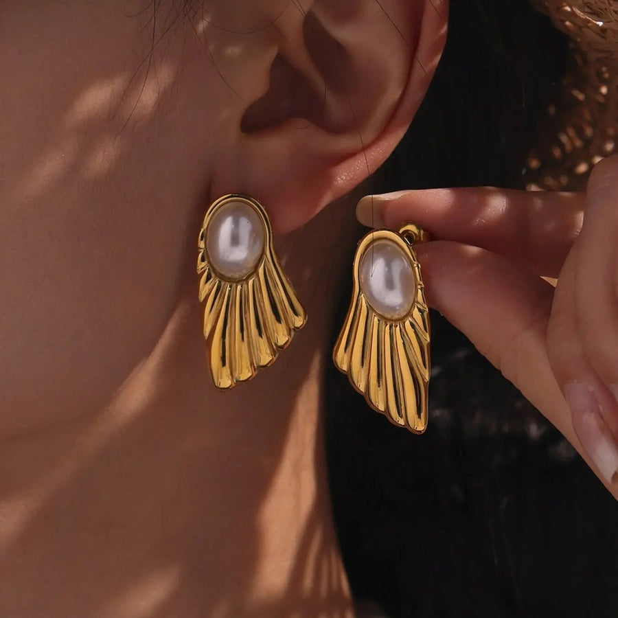 Éventail Gold Pearl Stud Earrings on the ear, worn