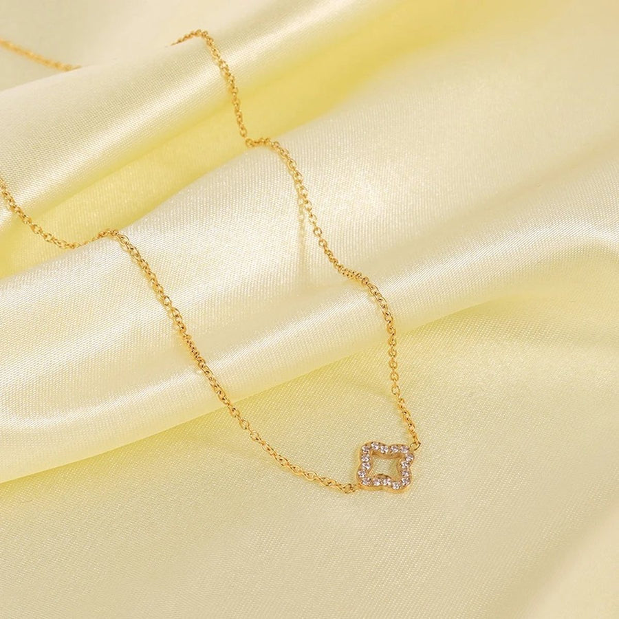 Lucca Gold Four-Leaf Clover Necklace, flat lay