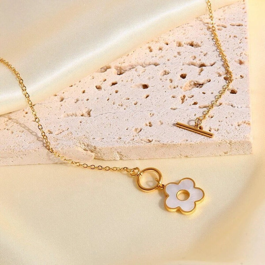 Marguerite Toggle Gold Flower Necklace, flat lay