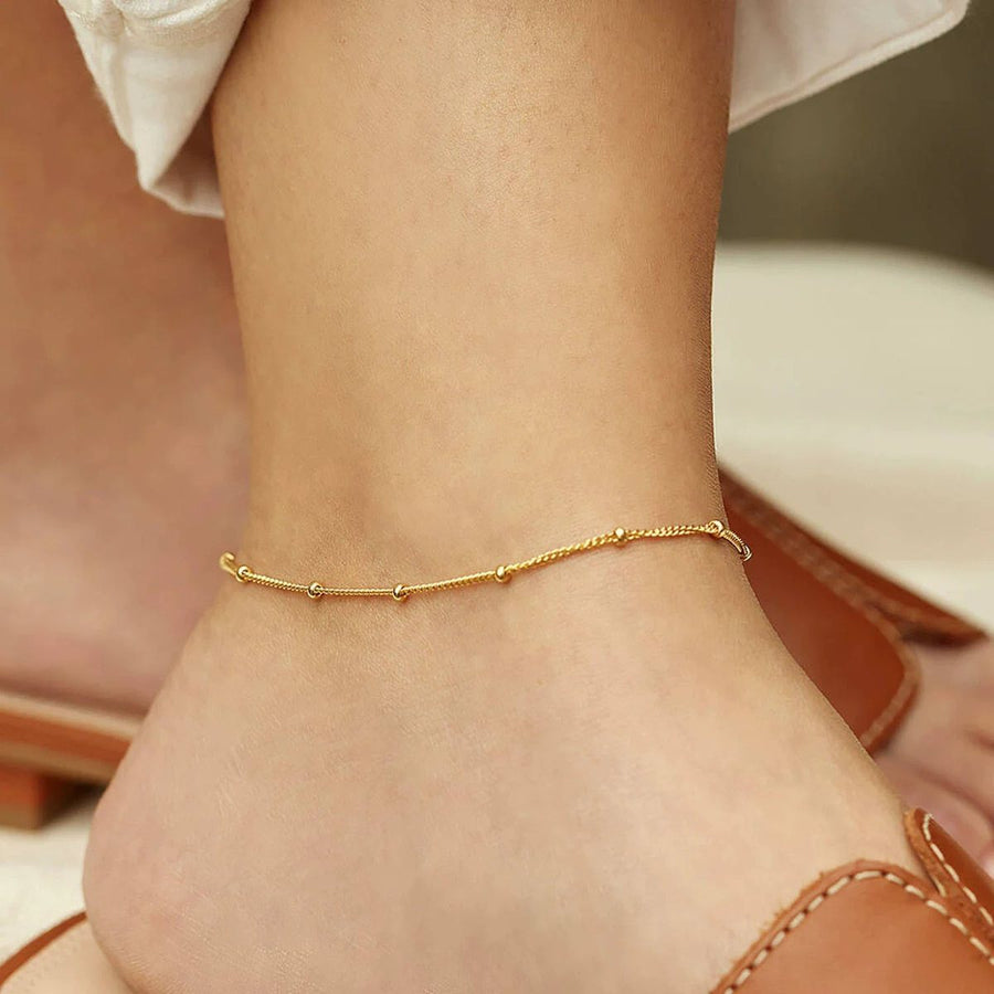 Perle Bead Gold Anklet on the ankle, worn