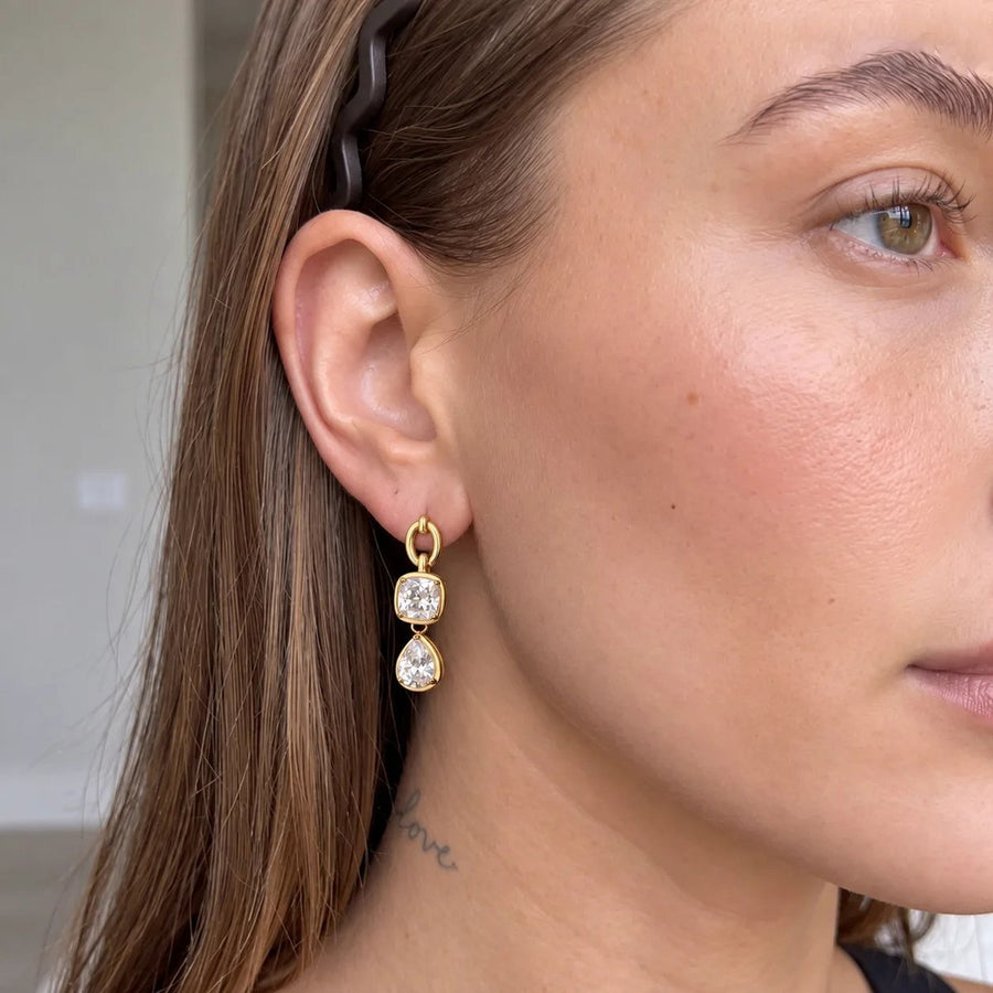 Amour Heart Link Gold Drop Earrings on the ear, worn