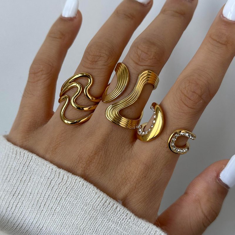 Cadence Gold Wave Ring, open gold ring shaped like a flowing wave