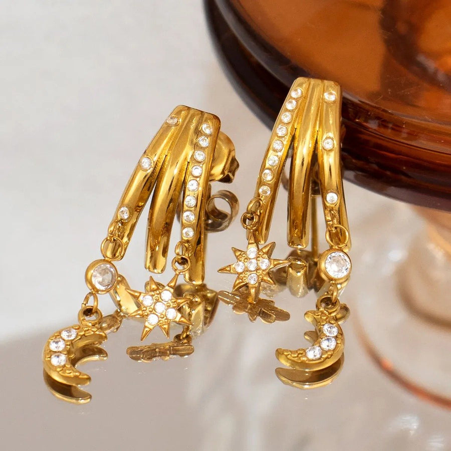 Celeste Star and Moon Gold Drop Earrings, close-up detail