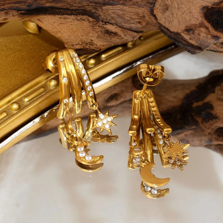 Celeste Star and Moon Gold Drop Earrings, close-up of the finish