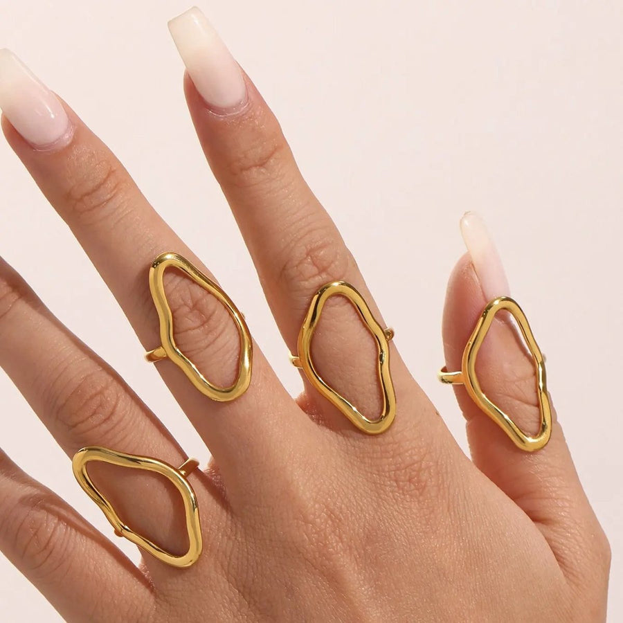 Contour Line Gold Stacking Ring on the hand, worn