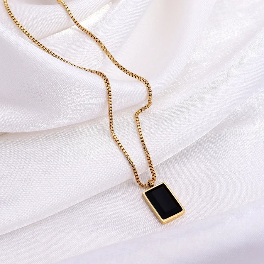 Ébène Square Gold Pendant Necklace, flat lay