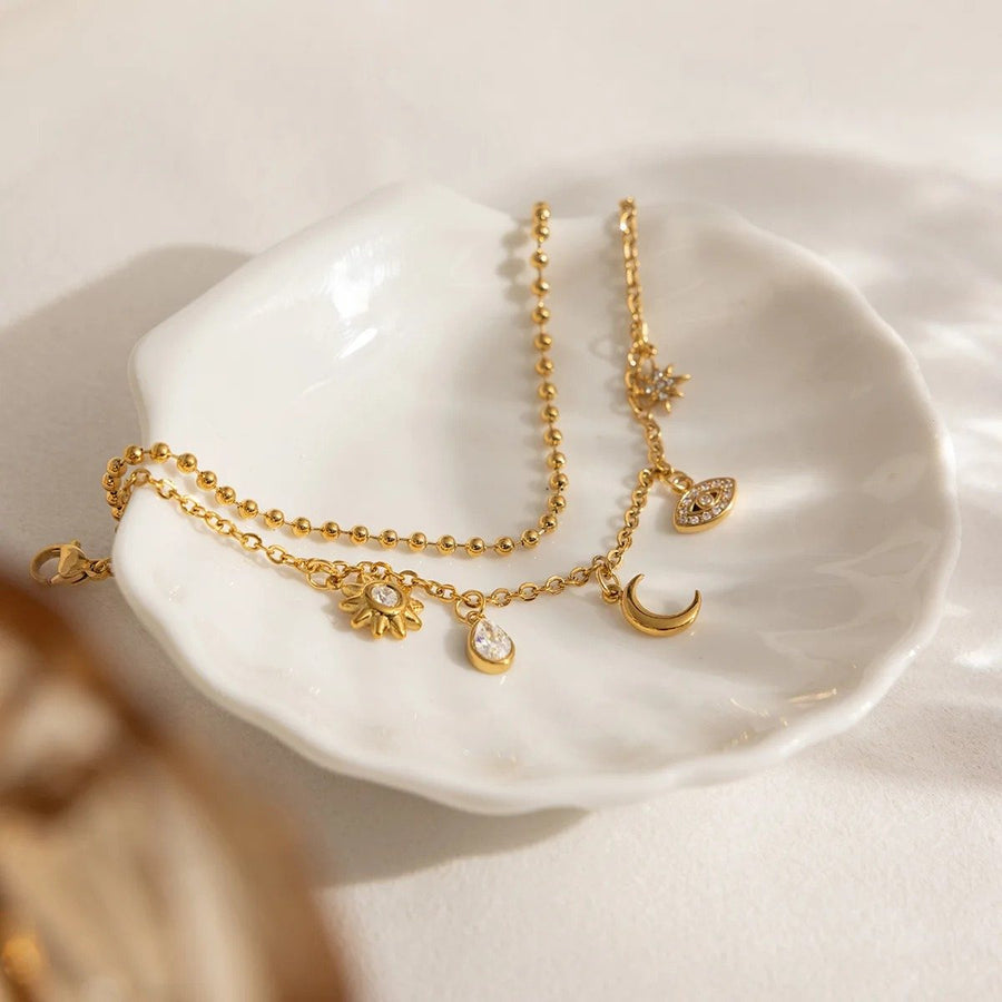 Eclipse Gold Charm Bracelet, flat lay
