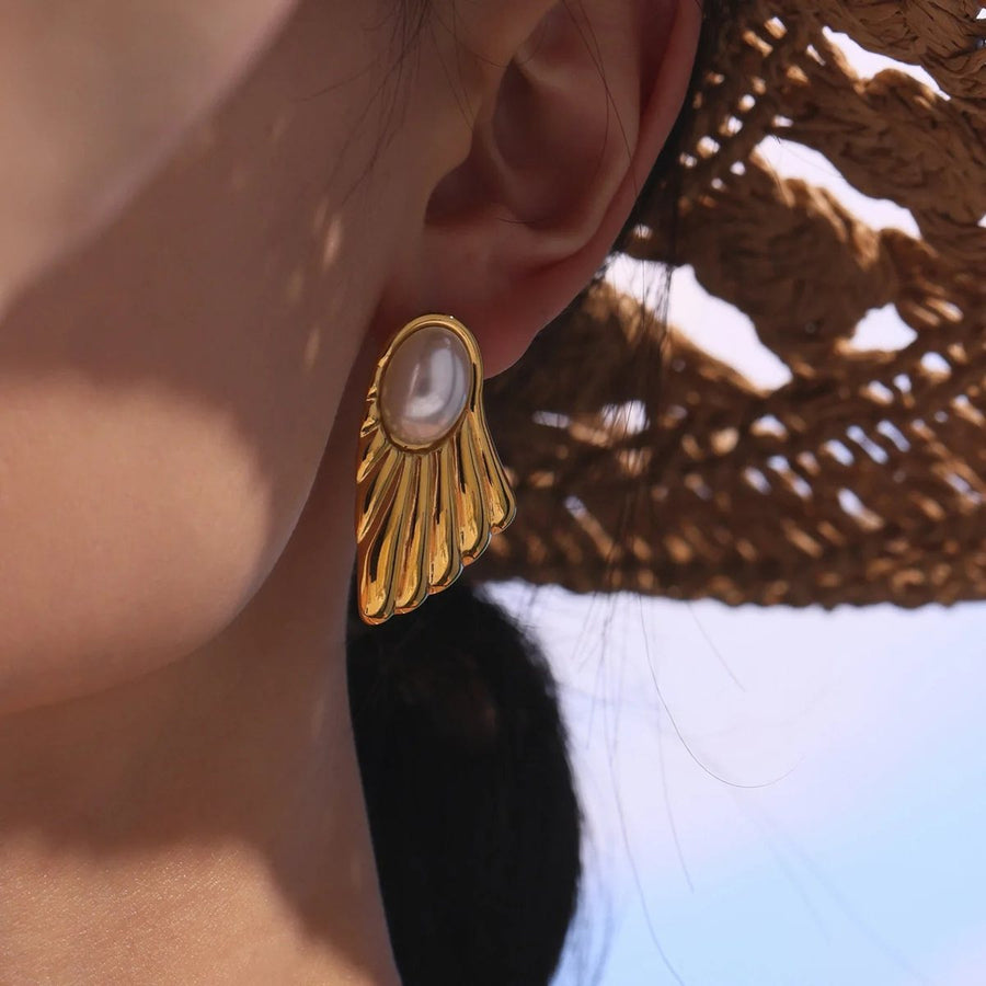 Éventail Gold Pearl Stud Earrings on the ear, worn