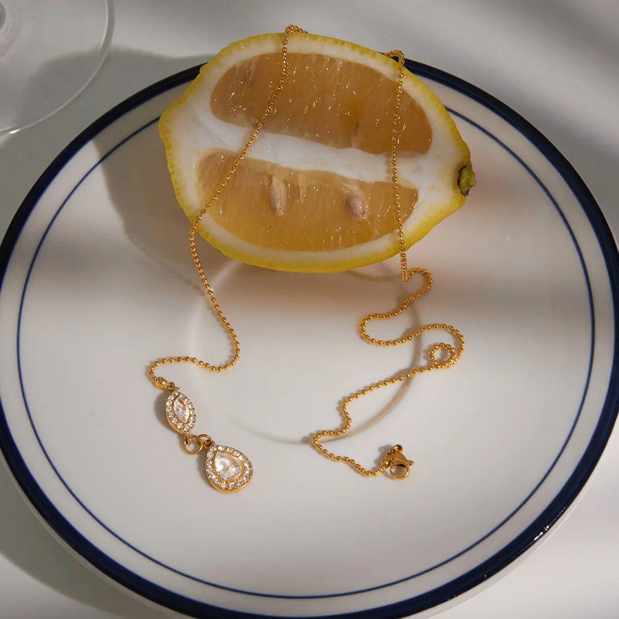 Halo Teardrop Pendant, pendant necklace, flat lay