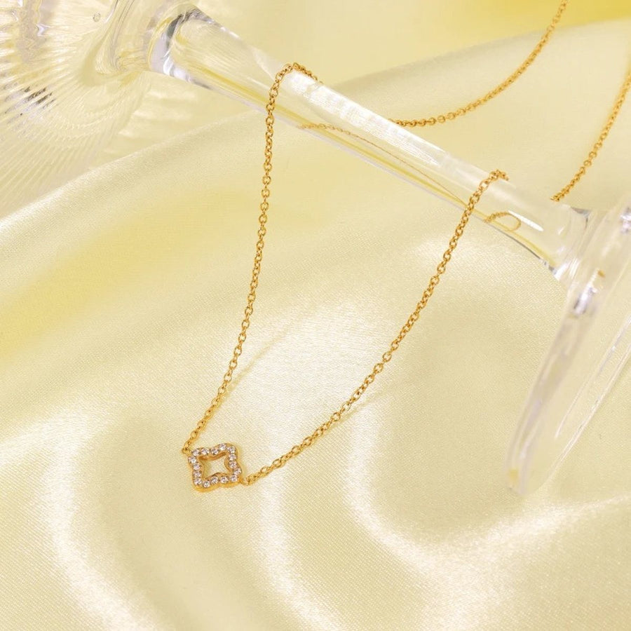 Lucca Gold Four-Leaf Clover Necklace, flat lay