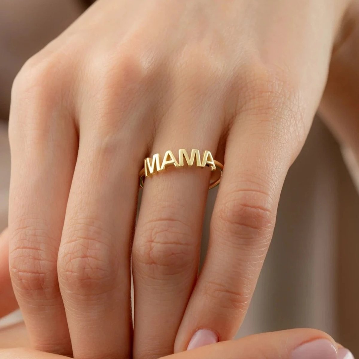 Mama Letter Gold Stacking Ring on the hand, worn