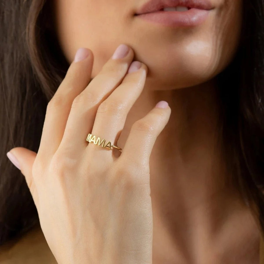 Mama Letter Gold Stacking Ring on the hand, worn