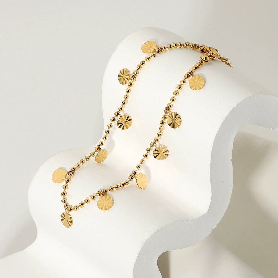 Marigold Disc Anklet, charm anklet, flat lay