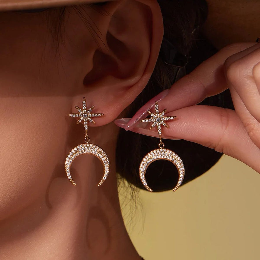 Nocturne Crescent Moon Gold Drop Earrings on the ear, worn