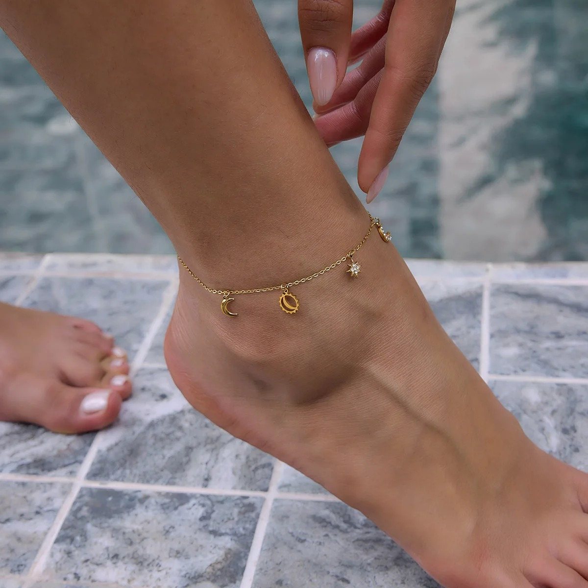 Riviera Star Gold Charm Anklet on the ankle, worn