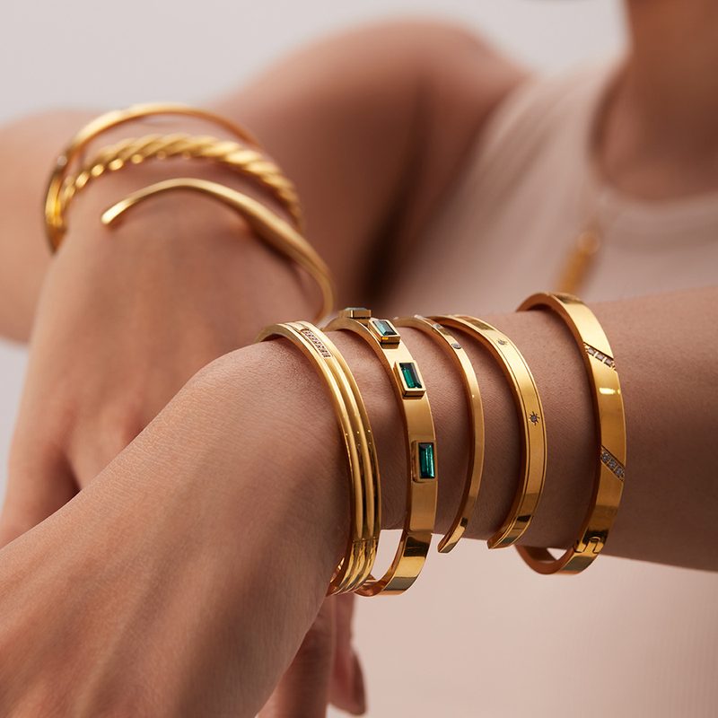 Rivière Baguette Gold Bangle, polished gold bangle set with white baguette stones