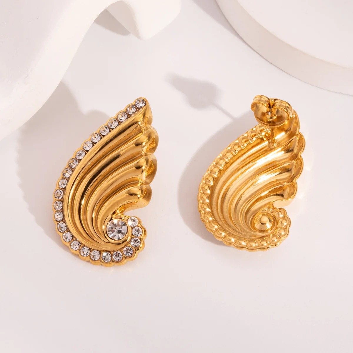 Seraphine Wing Studs, stud earring, flat lay
