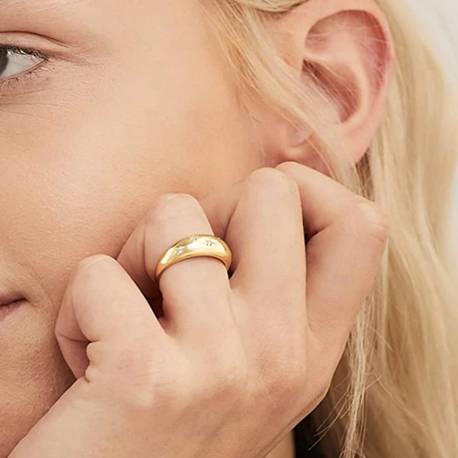 Stella Star Gold Dome Ring on the hand, worn